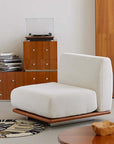 Modern white Nozomi Banca Sofa in stylish living room setting with wooden furniture and turntable.