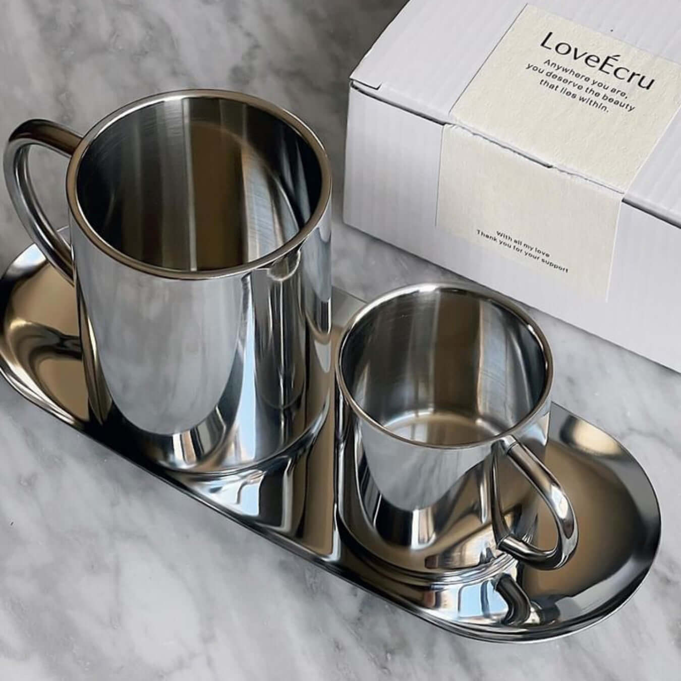 Elegant Milano Duo Set with double-walled stainless steel cups and tray on marble surface, perfect for modern coffee enjoyment.