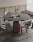 Elegant Italian minimalist solid wood round table with chairs, showcasing timeless craftsmanship and sophisticated dining room design.