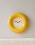 Yellow Bagel Clock, glossy ring-shaped wall clock with cream dial