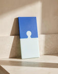 Blue Cheese Puzzle Pop Chopping Board, blue and mint, standing upright
