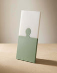 Sage Green Puzzle Pop Chopping Board, green and white, standing upright