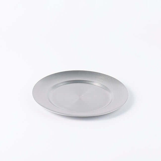 Stainless steel vintage round plate with a chic design, ideal for versatile use, shown on a plain background.