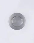 Vintage INOX round stainless steel plate on a white background, showcasing its durable and chic design.