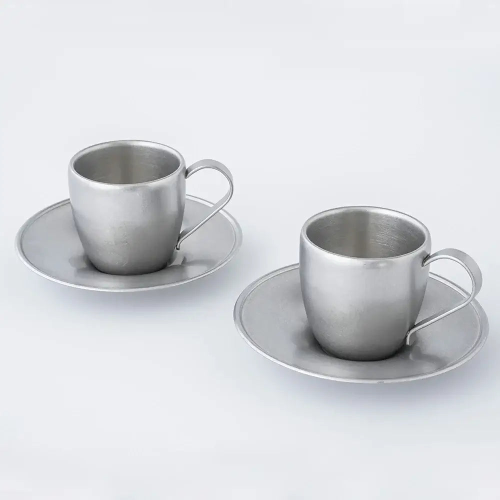 Vintage Inox stainless steel cup and saucer set from Japan, dishwasher safe, shown on a white background.