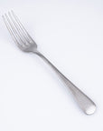 Vintage Inox Old English dinner fork with a smooth handle design, ideal for luxurious dining and versatile use in formal settings.