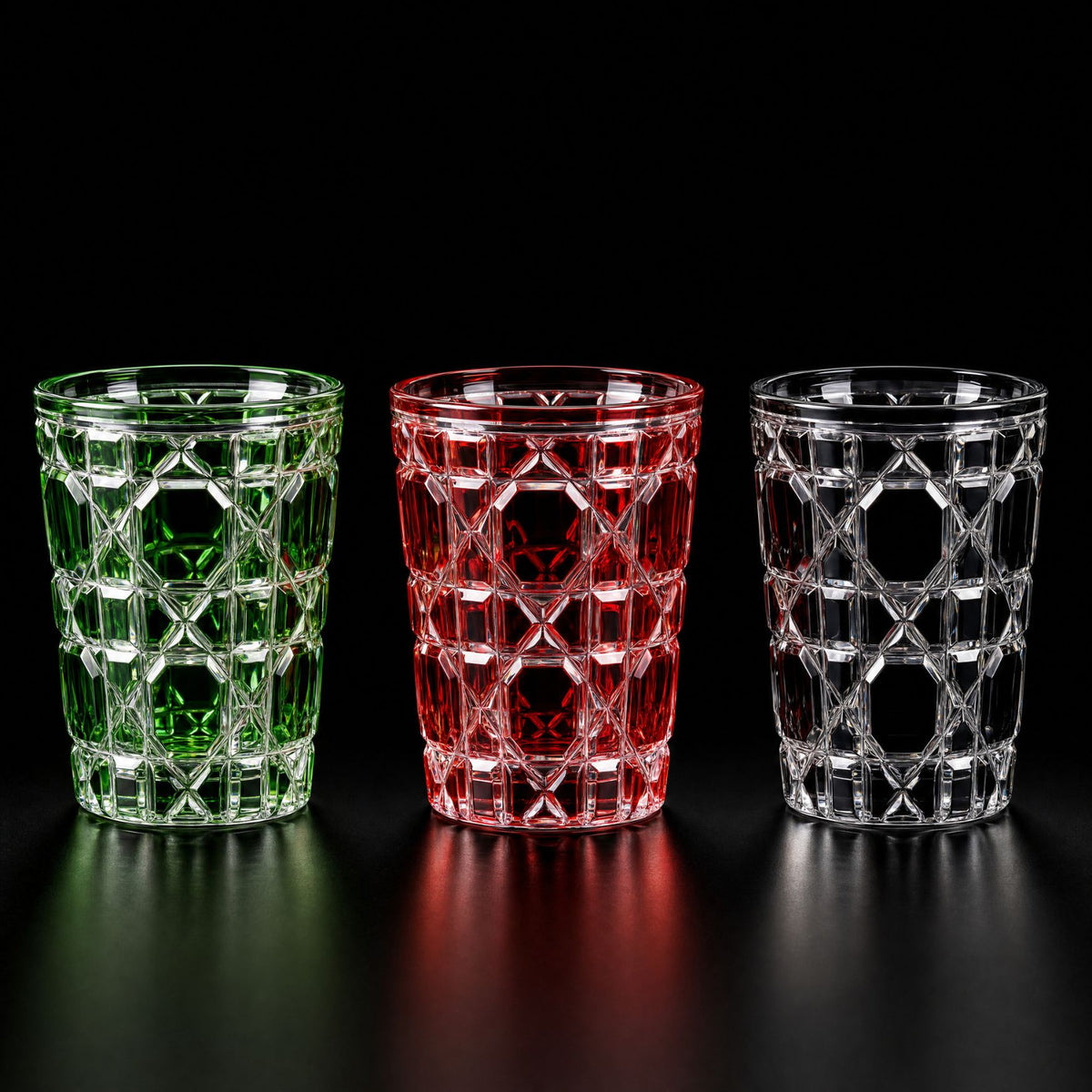Green, red and black Vetra Lattice hand-painted glasses side by side on a black background