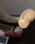 Nautilus Table Lamp — spiral shell-shaped translucent lamp by LoveÉcru