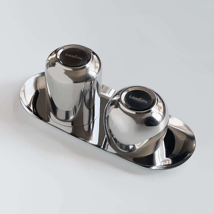 Kyoto Set with two stainless steel cups on a sleek tray, featuring a mirror finish and LoveÉcru logo engraving.