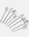 Minimalist Stainless Steel Flatware Set for two with cut-out handles, laid out flat