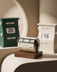 Vintage Perpetual Desk Calendars in green and cream with the wheel calendar on a curved shelf