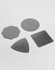 Sculpt Coasters set of four: circle, square, triangle and hexagon in brushed stainless steel