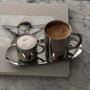 Milano Duo Set with stainless steel cups on marble table, showcasing modern design and functionality for coffee lovers.