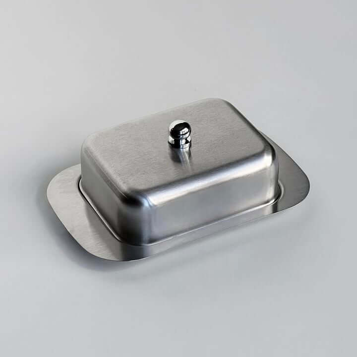Stainless steel butter dish with lid from LoveÉcru, perfect for keeping butter fresh and stylishly elevating your breakfast table.