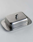 Stainless steel butter dish with lid from LoveÉcru, perfect for keeping butter fresh and stylishly elevating your breakfast table.