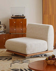 Modern Nozomi Banca Sofa in stylish living room with wooden accents and decorative rug, highlighting contemporary furniture design.