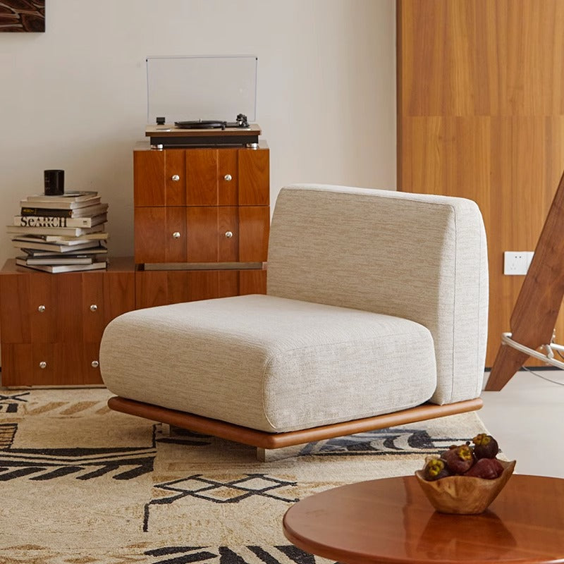 Modern Nozomi Banca Sofa in stylish living room with wooden accents and decorative rug, highlighting contemporary furniture design.