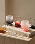Sculpted Pedestal Glasses in frosted black, pink and clear, group view