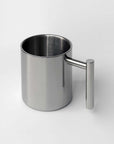 Bern Mirror Mug, empty, showing its straight cylinder and vertical handle