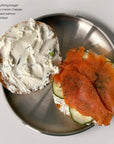 Stainless steel plate from the Set of Six with a bagel, cream cheese and smoked salmon