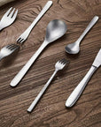 Kyoto Cutlery Set fork, spoons and knife on wood, close-up