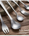 Kyoto Cutlery Set forks and spoons fanned out on a wooden table