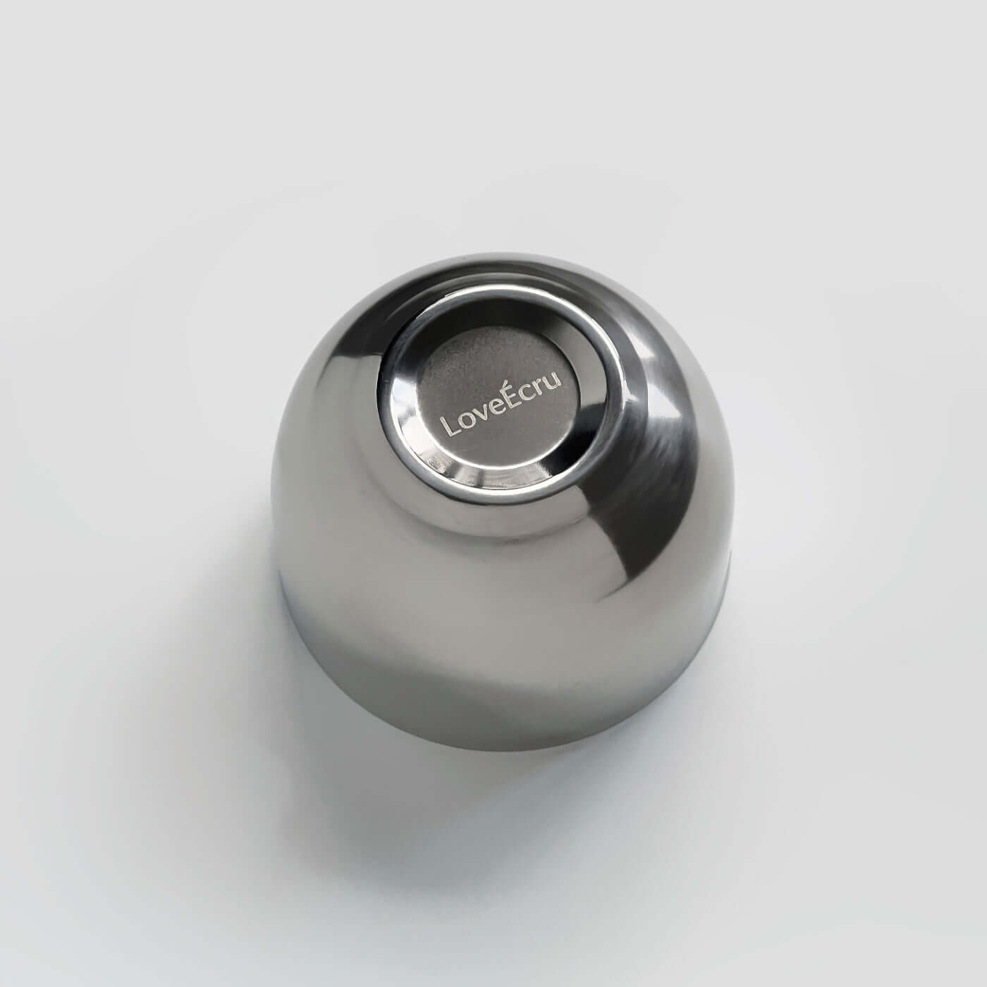 Stainless steel spherical cup with LoveÉcru logo on bottom, ideal for espresso or desserts, elegant and practical design