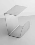 Bauhaus Steel Accent Table & Magazine Holder, folded steel form on white