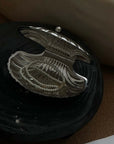 Vintage Shell-Shaped Silver Trinket Case on a dark cushion