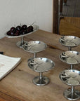 Six Elegant Dessert Cups on a wooden table with cherries