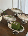 Elegant Dessert Pedestal Stands on a wooden table with matcha cake and cookies