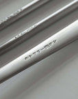 Japanese retro stainless steel cutlery set close-up with engraved text.