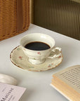 Retro French Blossom Cup & Saucer Set with Coffee on Table
