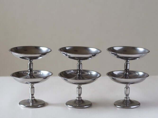 Elegant stainless steel dessert cups set on a table, perfect for enhancing dining with sophistication and versatile use.