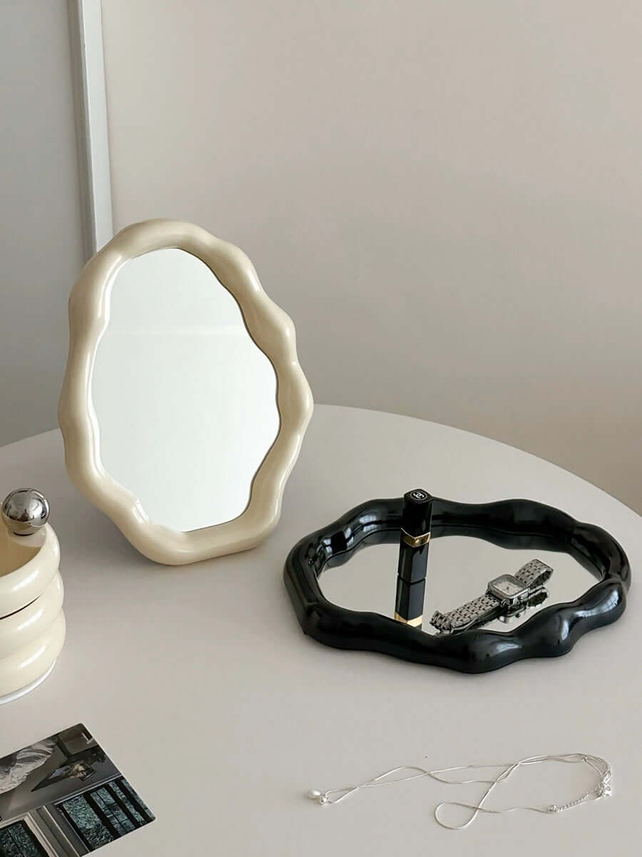 Nordic cloud-shaped vanity mirror in cream and black with accessories, on a white table, size 27x20cm - 10.6x7.85 inches, free shipping.