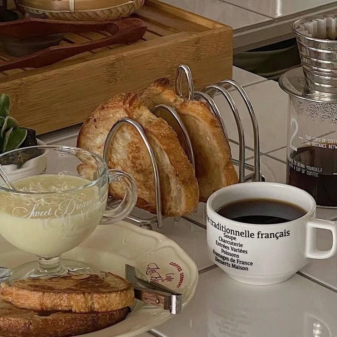 Elegant 304 stainless steel toast holder with six slots, keeping breakfast toast warm and crisp. Sophisticated kitchen accessory.