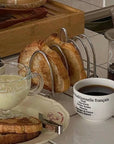 Elegant 304 stainless steel toast holder with six slots, keeping breakfast toast warm and crisp. Sophisticated kitchen accessory.