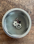 Kiyomi fine-mesh matcha sieve with cat and paw charm rests on a wooden table