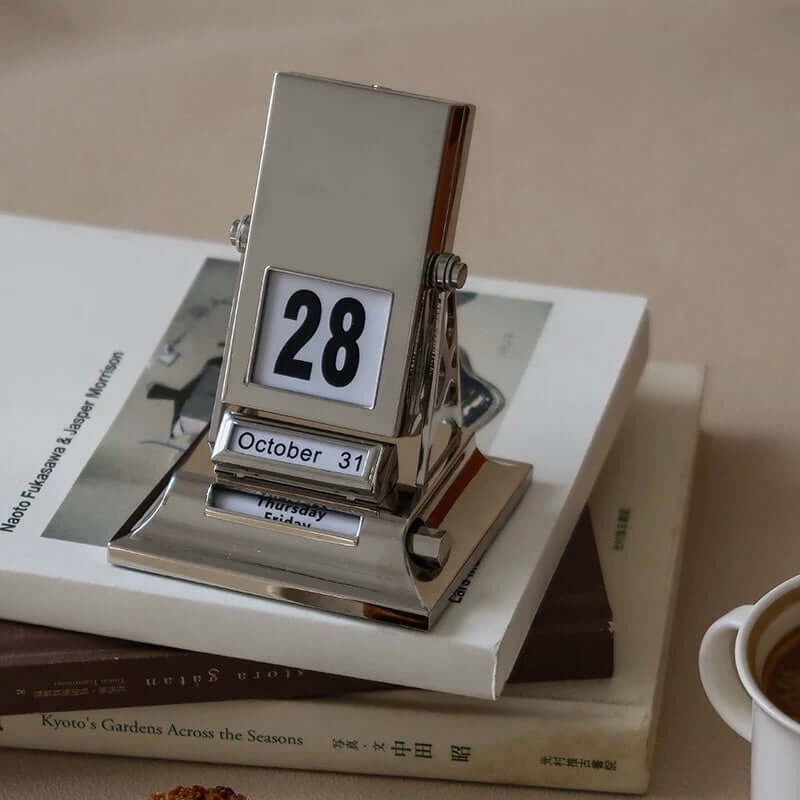 Timeless Rotating Desk Date Keeper on books, elegant and functional Nordic perpetual calendar with free shipping.