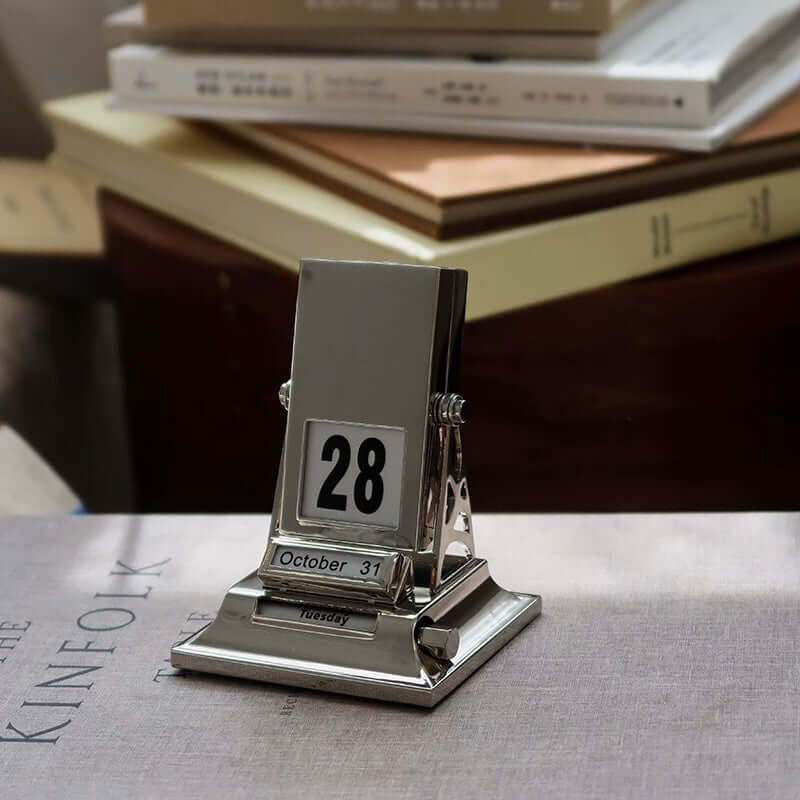 Timeless Rotating Desk Date Keeper with stylish Nordic design, handcrafted mechanical calendar on desk, October 31 displayed