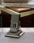 Timeless Rotating Desk Date Keeper with stylish Nordic design, handcrafted mechanical calendar on desk, October 31 displayed