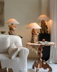 Elegant custom-crafted wooden lamps in a cozy living room setting, showcasing unique designs and warm lighting ambiance.