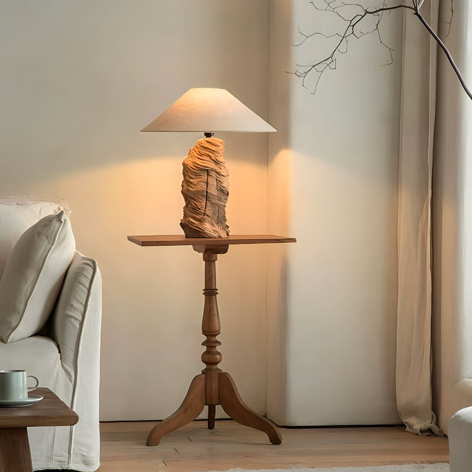 Custom-crafted wooden lamp on a wooden side table, illuminating a cozy living room corner.
