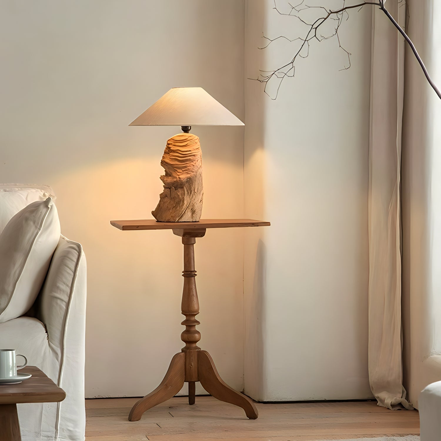 Custom-crafted wooden lamp on elegant side table in cozy living room setting.