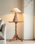 Custom-crafted wooden lamp on elegant wooden stand in cozy living room setting.