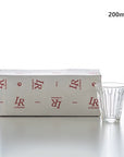 Zinc Coffee Glass Cup with ridged design and 200ml capacity next to branded box, inspired by French brasserie counter tops.