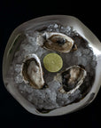 Oysters on crushed ice served in the Sculpted Stainless Steel Bowl