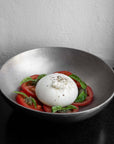 Kyoto Stainless Steel Bowl with burrata, tomatoes and basil on a dark table