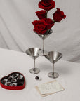 Stainless Steel Martini Glasses on a table with red roses and a heart-shaped box