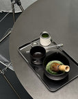 Minimalism Stainless Steel Serving Tray with a matcha set on a round table
